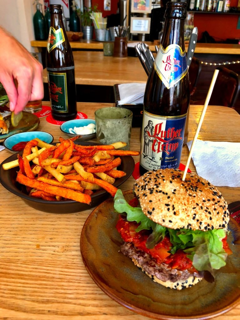 A burger, combo of sweet potato and regular fries washed down with a Luther beer.