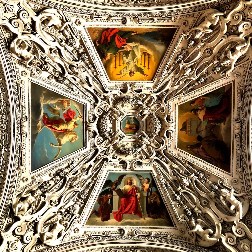 Painted sections of ceiling in the Salzburg Cathedral. Each separate section depicts different scenes from the Bible.