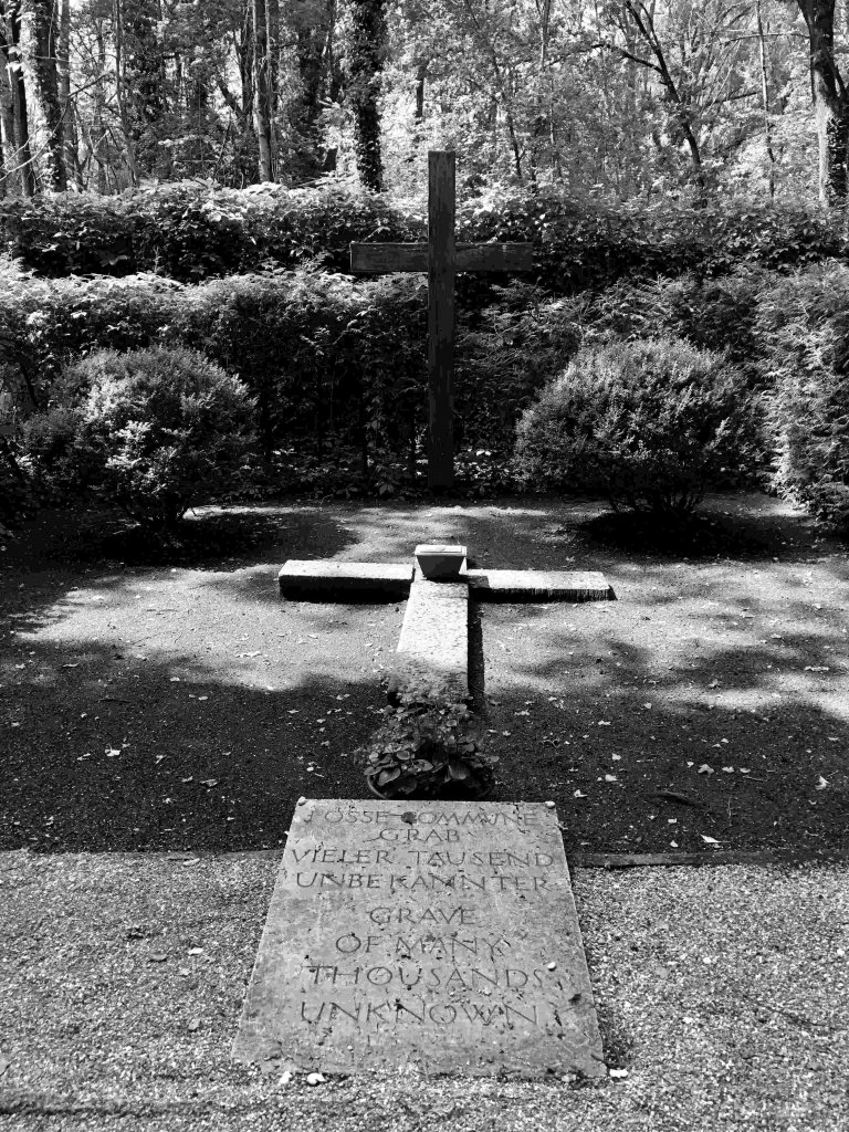 Grave of thousands of unknown at Dachau Concentration camp. Two crosses mark the site.