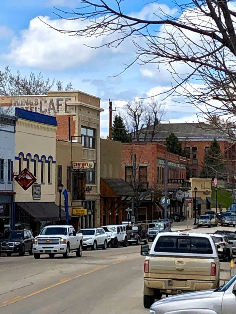 downtown Buffalo, Wyoming with traffic and buildings.
