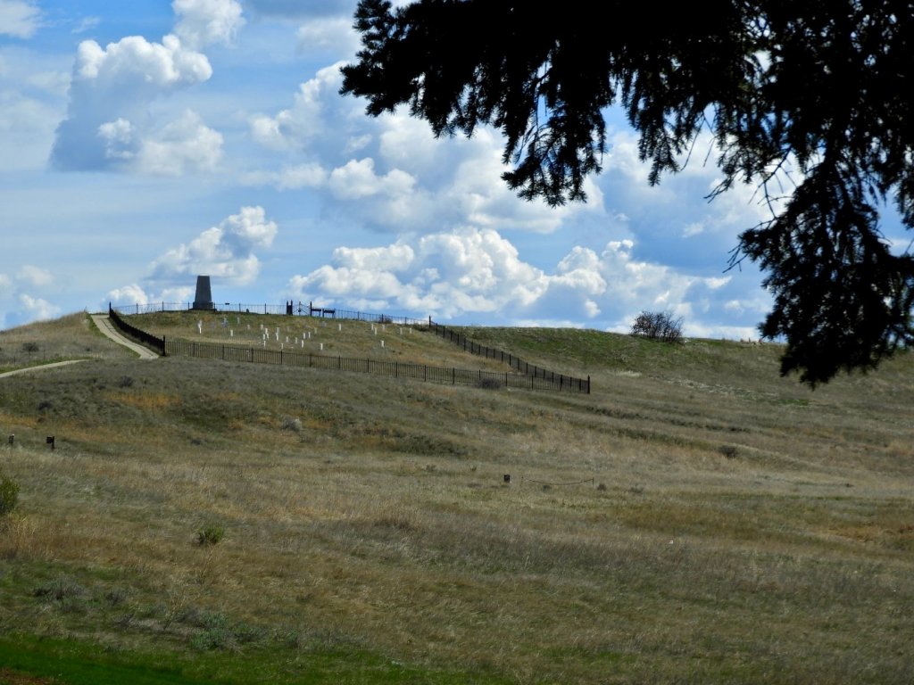 Custer Last Stand Hill with graves and monument.