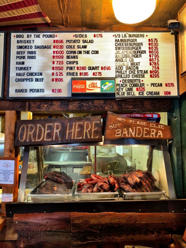 menu at Busbee's bbq with smoked meats displayed