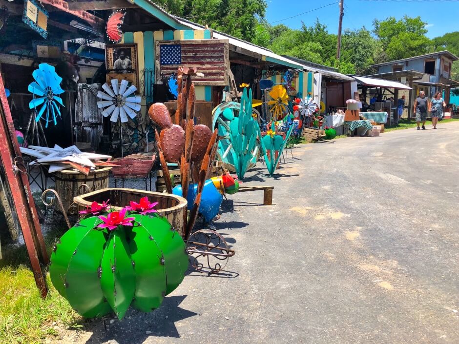 eclectic yard ornaments outside shacks at Wimberley Market