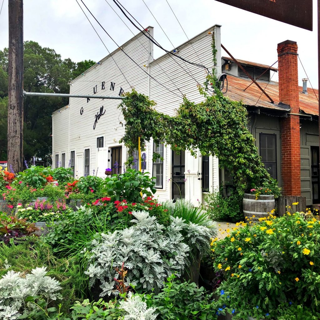 Gruene dance hall with flowers and foliage out front