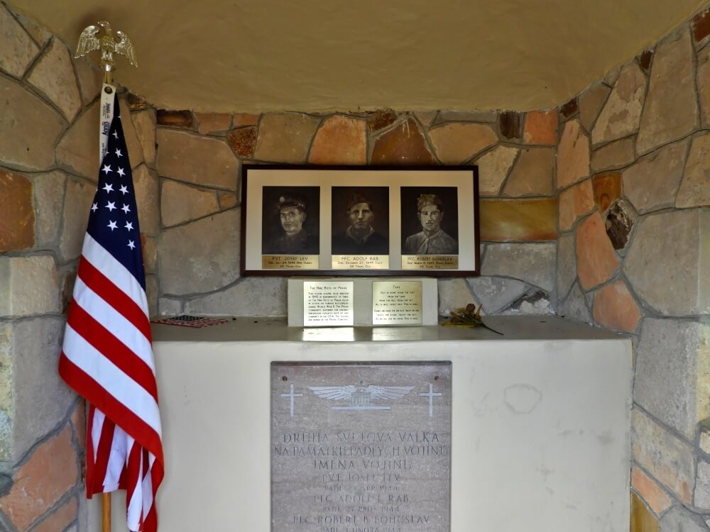 stone grotto dedicated to soldiers of world war 2 with American flag.