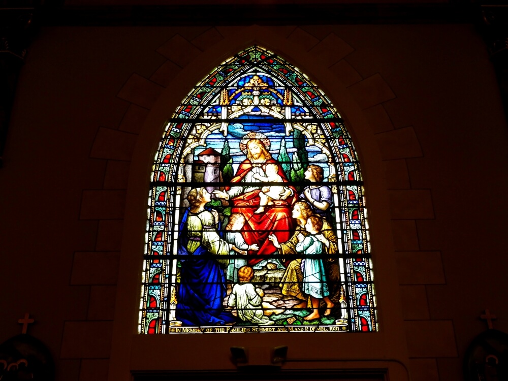 stained glass window of Jesus and little children