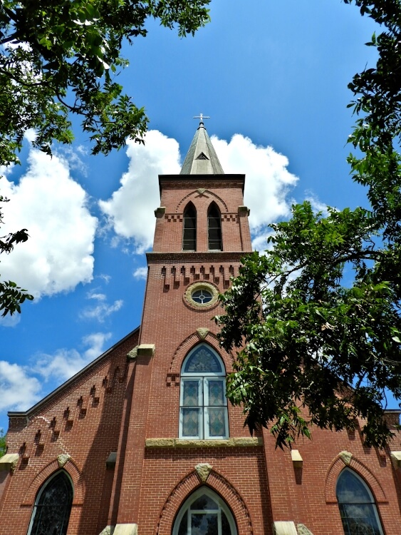 red brick church with steeple