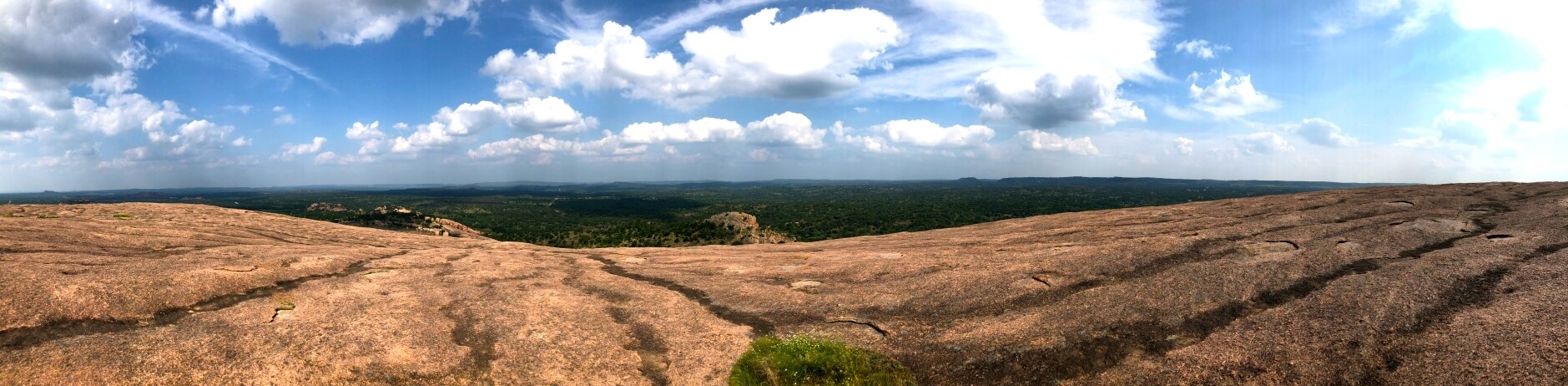 panoramic view at of Texas Hill Country at the top of Enchanted Rock State Natural Area