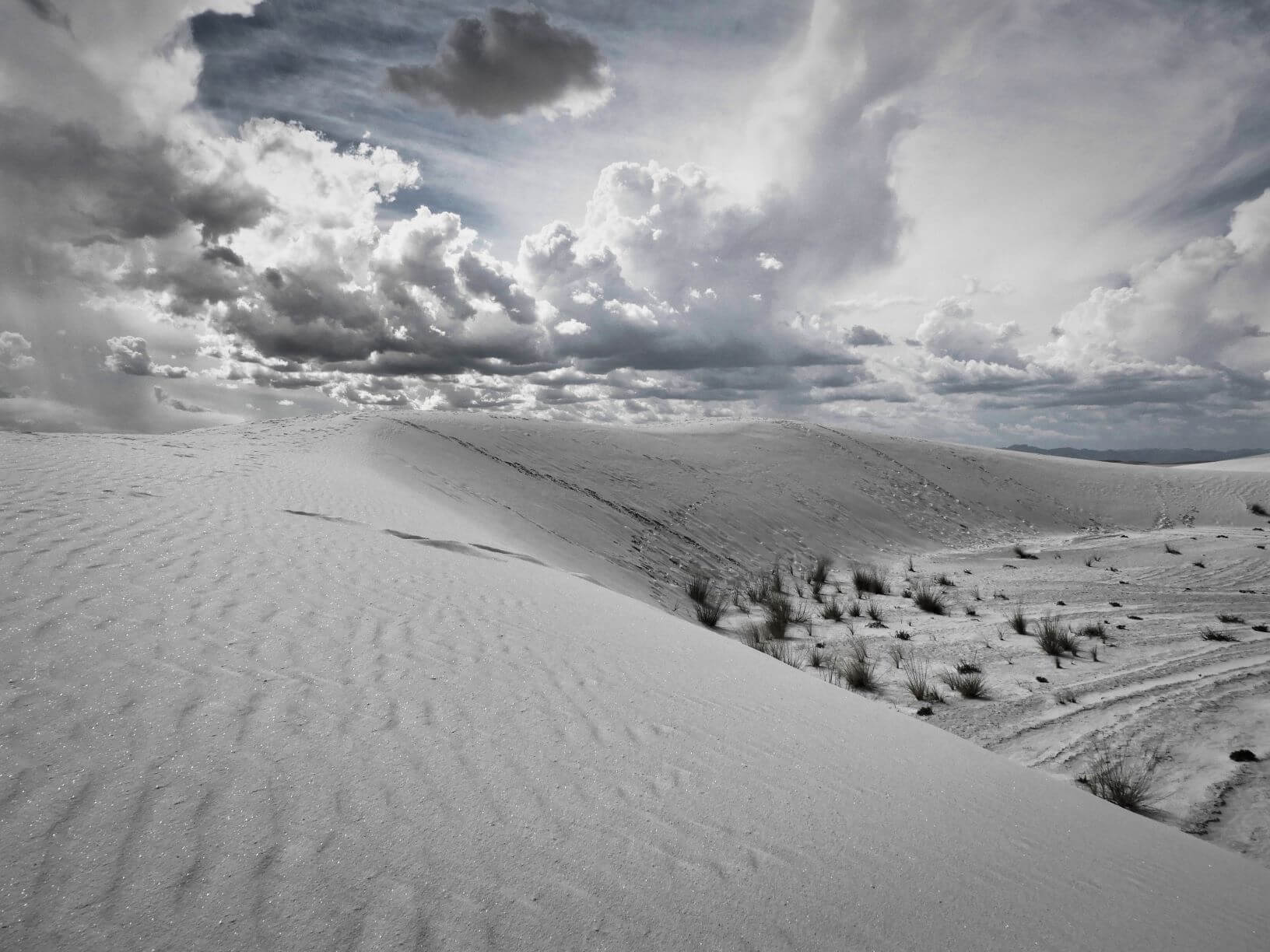 White sand dunes and clouds